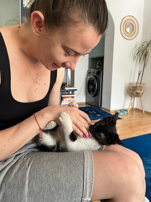 Claudia Diana Vaidos, HR Manager, and Moustache the Cat, on her adoption day
